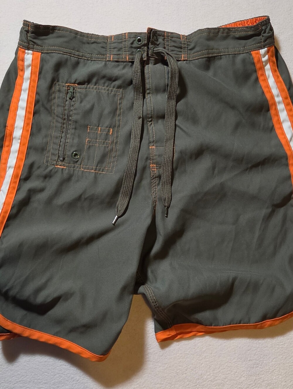 Joe Boxer olive swim trunks with orange trim